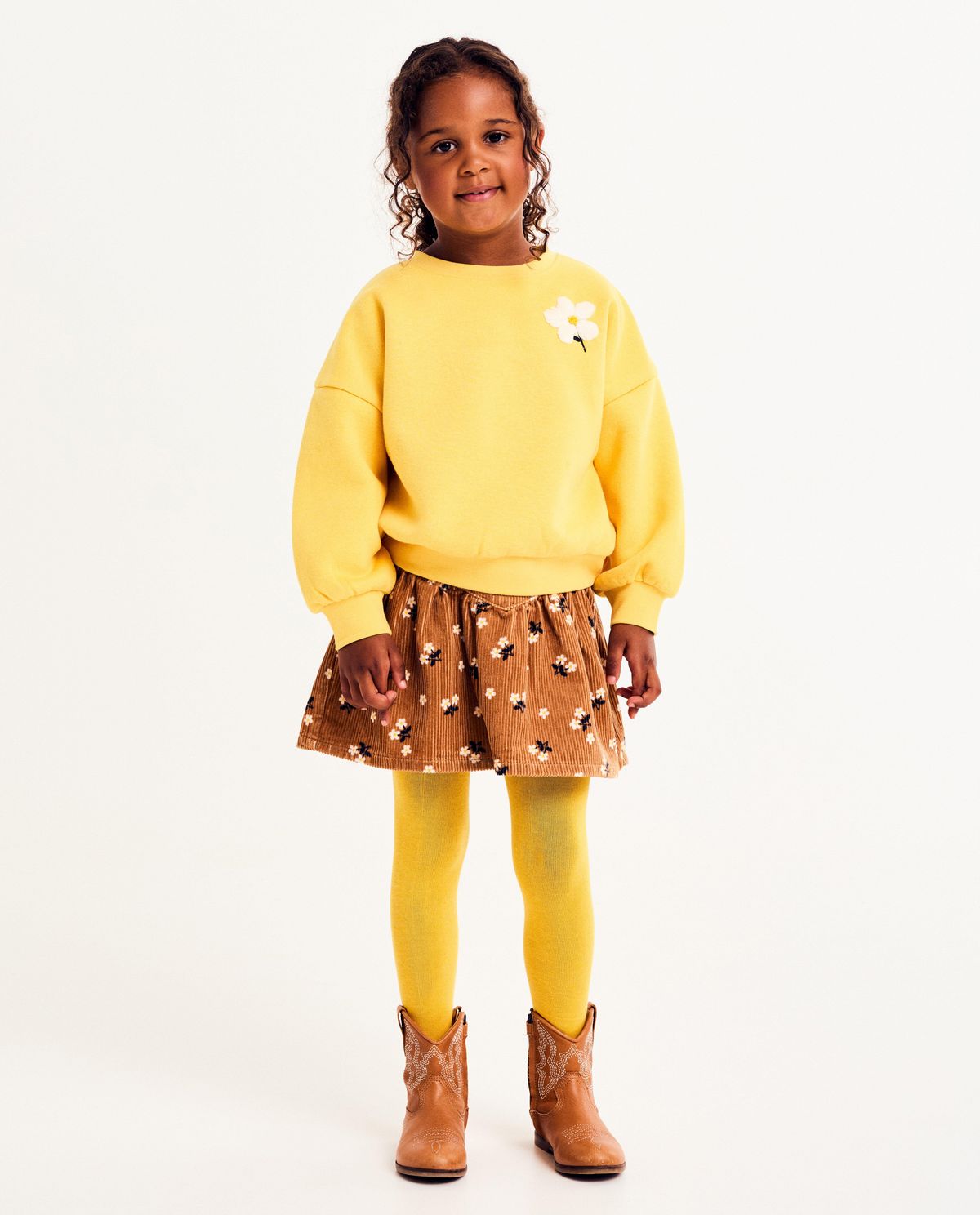 Ribfluwelen rok met bloemenprint