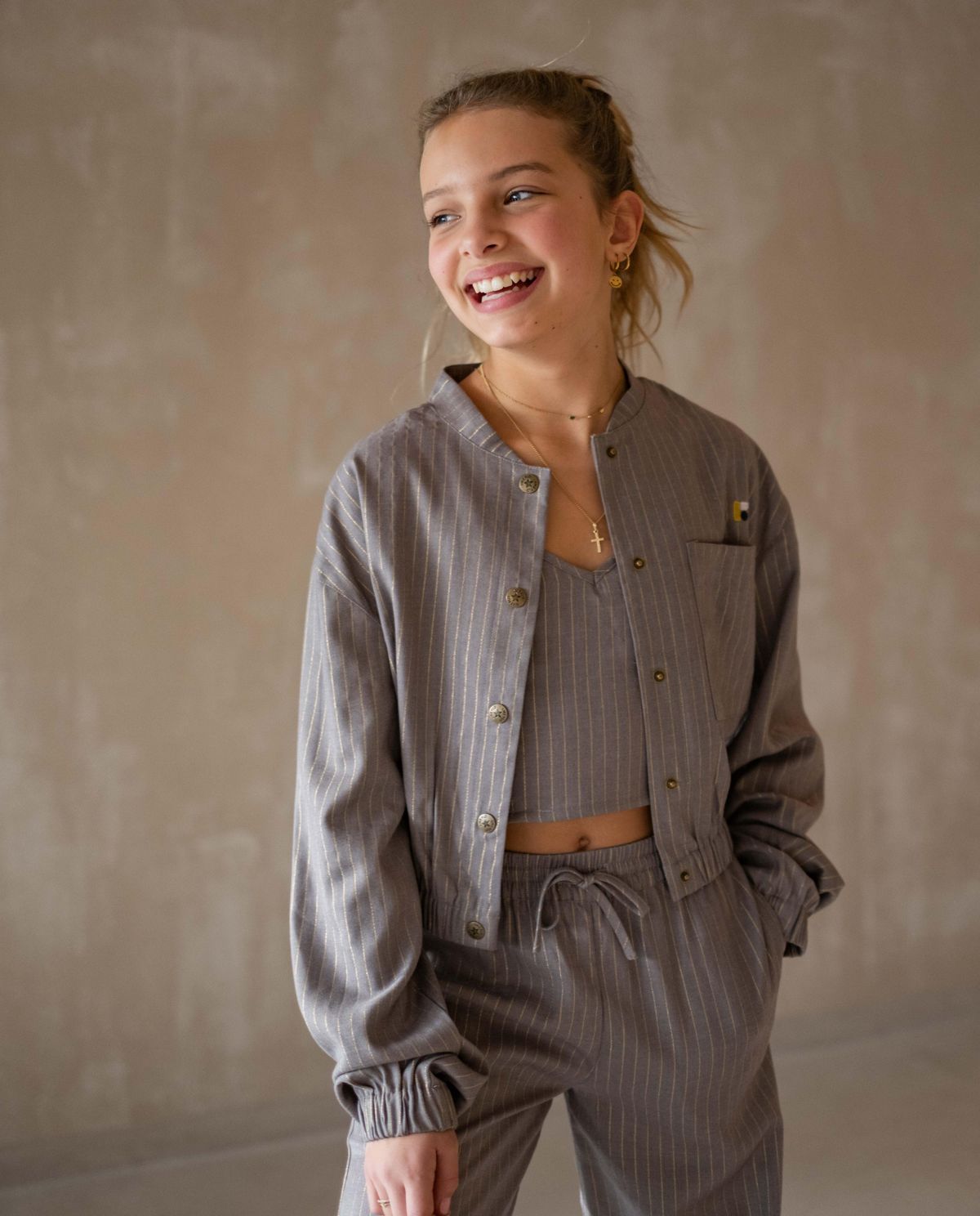 Bomber vestje met glitterstrepen