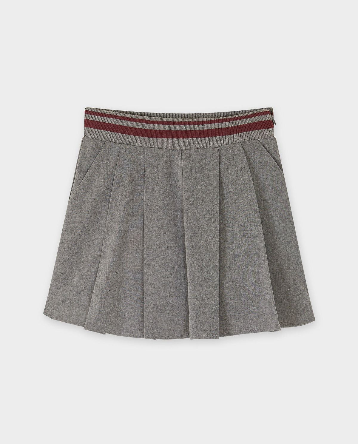 Grijze skort met plooien